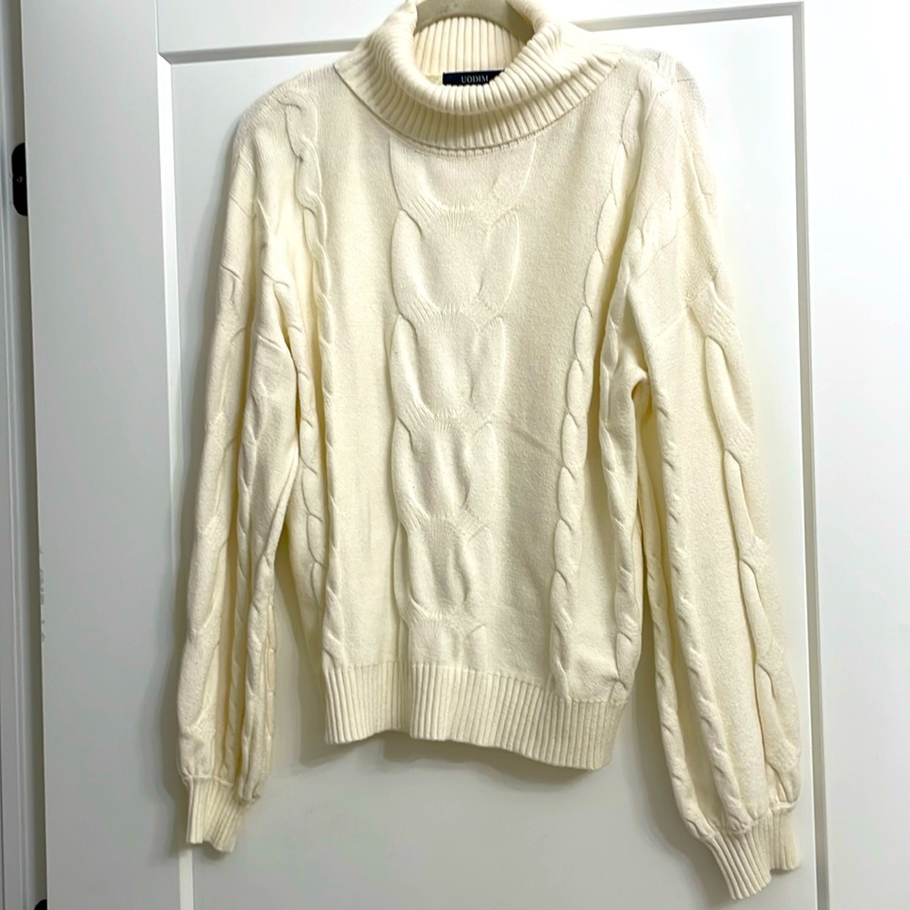 Cable knit cream turtleneck